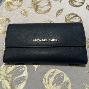 Gently used navy blue Michael Kors wallet.